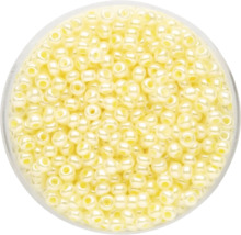 Gelbe Rocailles-Perlen in einem Behälter