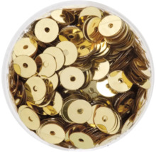 Goldene Pailletten in einer durchsichtigen Dose