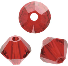 Drei rote Glasperlen in verschiedenen Formen