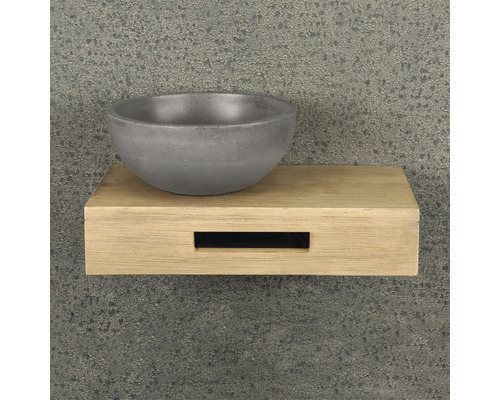 Lavabo en béton sur une étagère en bois
