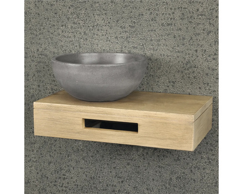 Lavabo en béton sur une étagère en bois
