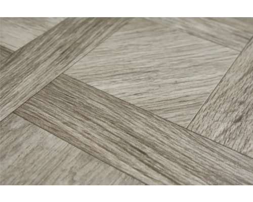 Gros plan d''un revêtement de sol en vinyle aspect bois avec un motif en damier