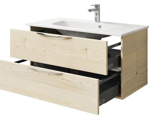 Meuble sous-lavabo avec deux tiroirs ouverts et lavabo en céramique