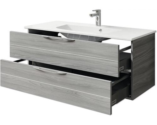 Meuble sous-lavabo avec deux tiroirs ouverts et lavabo à poser