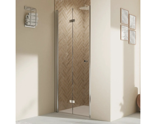 Porte de douche dans niche avec porte pivotante pliante BREUER Elana 2.0 100 x 200 cm couleur du profilé rond noir décor de vitre verre transparent butée de porte à gauche poignée tampon Porte de douche pliante en verre dans une salle de bains.