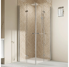 Cabine de douche d''angle avec portes en verre transparent et ferrures chromées dans une salle de bains avec des carreaux à chevrons.