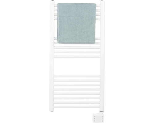 Sèche-serviettes blanc avec une serviette dessus