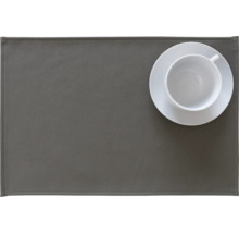 Graue Platzmatte mit weißer Tasse und Untertasse