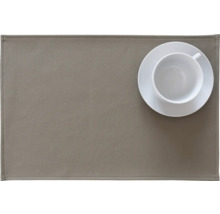 Tischset aus Kunstleder mit Tasse und Untertasse