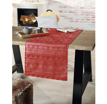 Chemin de table décoratif avec motif de Noël sur une table à manger
