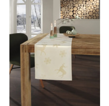 Décoration de table avec chemin de table, motif cerf et flocon de neige.