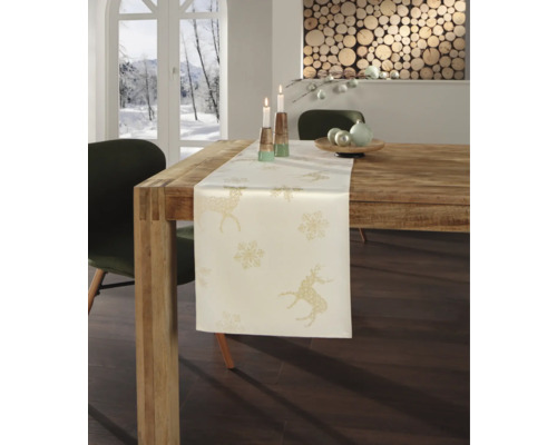 Décoration de table avec chemin de table, motif cerf et flocon de neige.