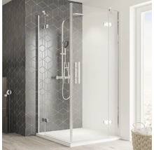 Eckdusche mit Duschwanne und Brausegarnitur in einem modern gestalteten Badezimmer.