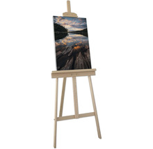 Staffelei mit Leinwandbild eines Sees bei Sonnenuntergang