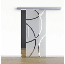 Porte coulissante en verre avec motif circulaire devant un mur blanc