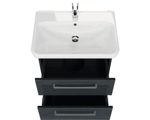 Meuble-lavabo avec deux tiroirs ouverts et robinet