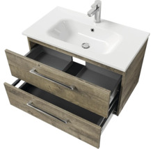 Meuble sous-lavabo avec système de tiroirs ouverts et lavabo à poser
