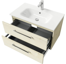 Meuble sous-vasque avec deux tiroirs ouverts, lavabo et robinet