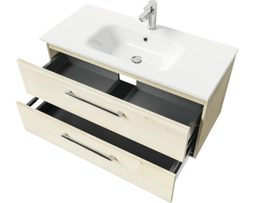 Meuble sous-vasque avec deux tiroirs ouverts et lavabo en céramique