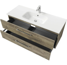 Meuble sous-lavabo avec deux tiroirs ouverts et lavabo