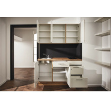 Cuisine compacte avec évier, plaque de cuisson, armoires et tiroirs pour petits espaces