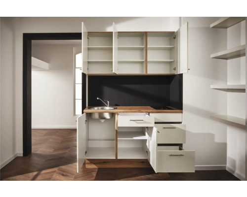 Cuisine compacte avec évier, plaque de cuisson, armoires et tiroirs pour petits espaces