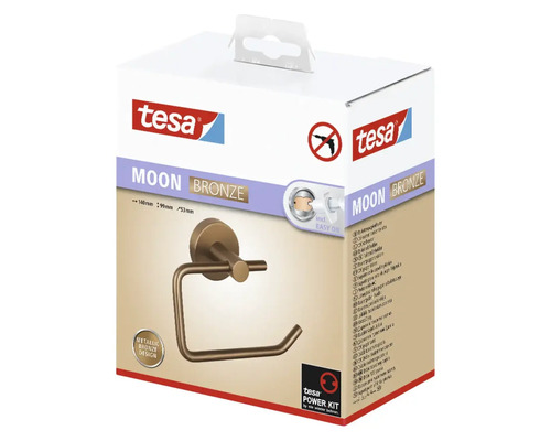 Verpackung einer bronzefarbenen Tesa Moon Toilettenpapierhalterung zur Wandmontage ohne Bohren