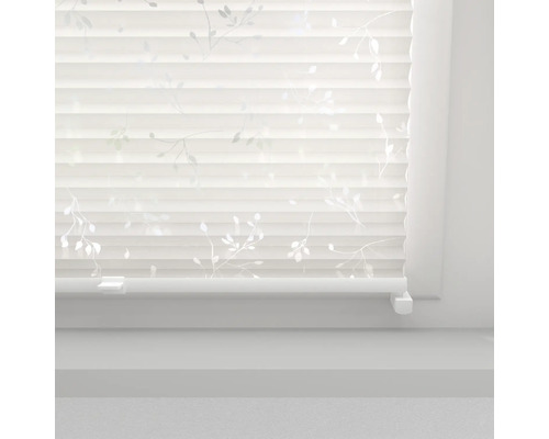 Store plissé avec motif de feuilles sur la fenêtre