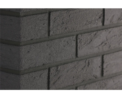 Elabrick Eckverblender Madagaskar 24 x 11,5 x 7,1 cm Nahaufnahme einer dunklen Ziegelwand mit Fugen