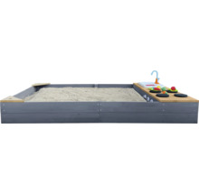 Bac à sable avec cuisine de jeu rempli de sable