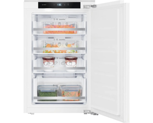 Congélateur ouvert avec des aliments dans les tiroirs