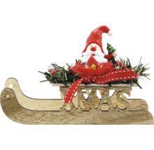 Holzschlitten mit Weihnachtsmannfigur, roter Schleife und grüner Dekoration als Weihnachtsschmuck