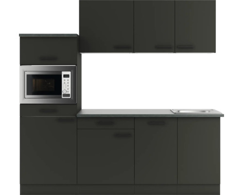 Küchenzeile mit Spüle, Mikrowelle und Schränken