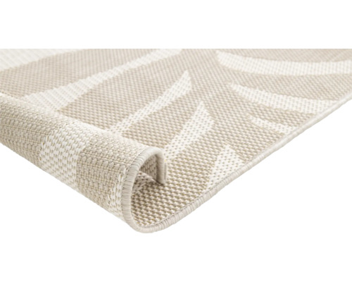 Vue détaillée d''un tapis d''extérieur beige à motif géométrique