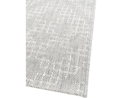 Detailansicht eines gewebten Teppichs mit geometrischem Muster