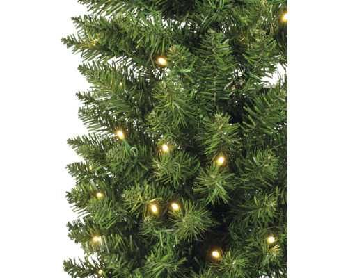 Gros plan sur un sapin de Noël artificiel avec des lumières LED.