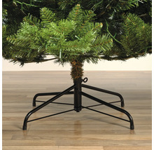 Gros plan d'un sapin de Noël artificiel avec un pied en métal noir