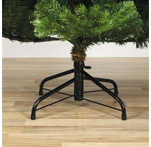 Gros plan sur un arbre de Noël artificiel avec un pied en métal.