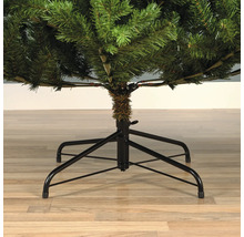Vue détaillée d'un sapin de Noël artificiel avec un support en métal noir