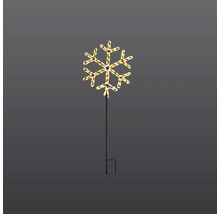 Schneeflocke mit Beleuchtung auf Erdspieß