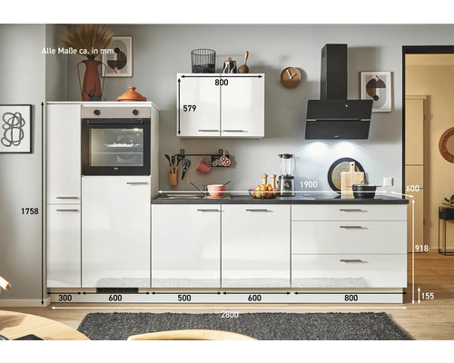 Cuisine avec armoires blanches et plan de travail foncé, dimensions incluses