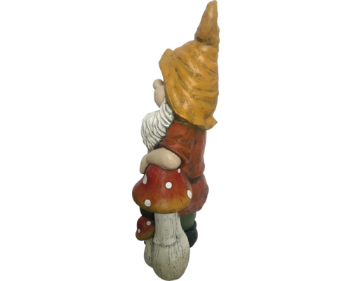 Figurine de gnome de jardin debout sur un champignon