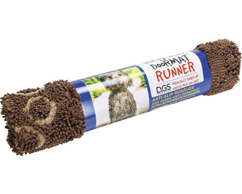Aufgerollter Fußabtreter mit Hunde-Motiv auf der Verpackung