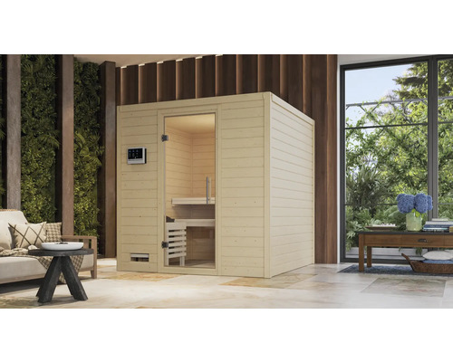 Massivholzsauna Karibu Wojave inkl. 9 kW Bio Ofen u.ext.Steuerung ohne Dachkranz mit Ganzglastüre aus Klarglas Freistehende Sauna mit Glastür und Bedienfeld in einem hellen Raum