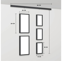 Bildergalerie mit Schiene zur Wandmontage und mehreren Rahmen in unterschiedlichen Größen