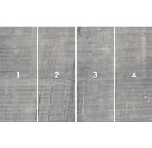 Gros plan de quatre plaques de béton avec différentes structures de surface