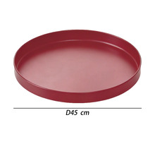 Soucoupe ronde pour plantes en rouge d'un diamètre de 45 centimètres.