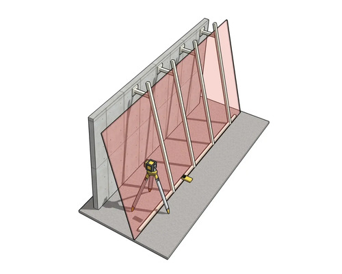 Laser de chantier sur trépied pour l'alignement vertical d'éléments muraux et de supports sur un mur en béton.