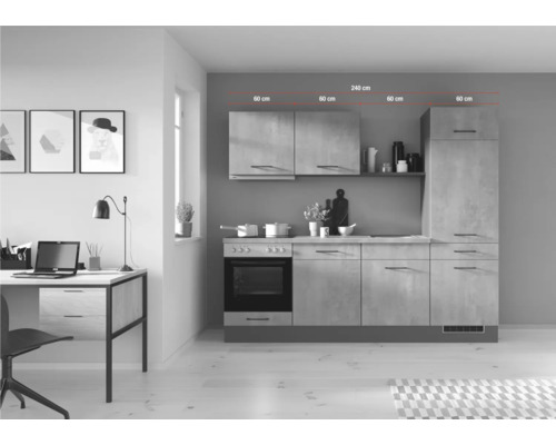 Cuisine équipée avec des meubles hauts, une cuisinière, un plan de travail et un bureau avec un ordinateur portable dans une pièce lumineuse.